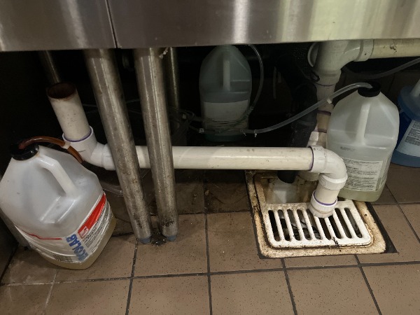 commercial sink drain pipe connected to floor drain