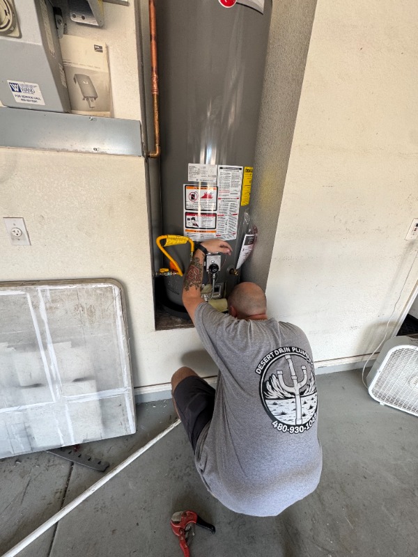 plumber repairing gas water heater