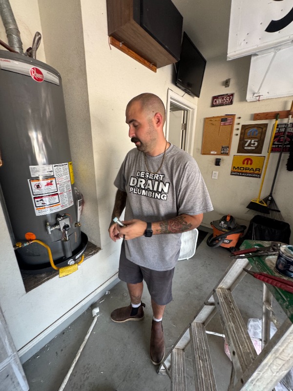 plumber inspecting residential water heater